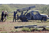 Ahrar al-Sham Islamic Movement prepare to fire grad rockets from Idlib countryside towards forces loyal to Syrias President Bashar al-Assad (Reuters Photo)