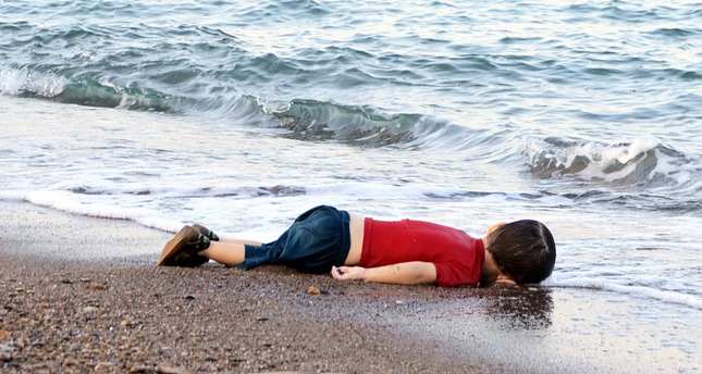 A Syrian boys body washed up on a Turkish shore in a failed attempt to sail to the Greek island of Kos (DHA Photo)