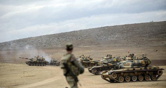The file photo captured on September 29, 2014, shows Turkish army tanks take position near the Syrian border in Suruç (AFP photo)