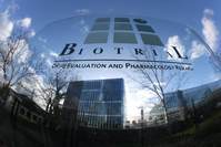 A logo of the Biotrial laboratory is displayed outside its building in Rennes, western France, Friday, Jan. 15, 2016. (AP Photo)