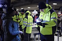 A passenger has her ID checked at the Copenhagen International Airport train station, the last stop before crossing the Öresund Bridge into Sweden. (AP Photo)