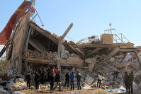 People gather around the rubble of a hospital supported by Doctors Without Borders (MSF) near Maaret al-Numan, in Syrias northern province of Idlib, on February 15, 2016, after the building was hit by suspected Russian air strikes.  (AFP Photo)