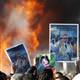 U.S. warships move through Suez, Gaddafi defiant