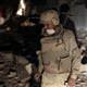 Air strike flattens building in Gaddafi compound