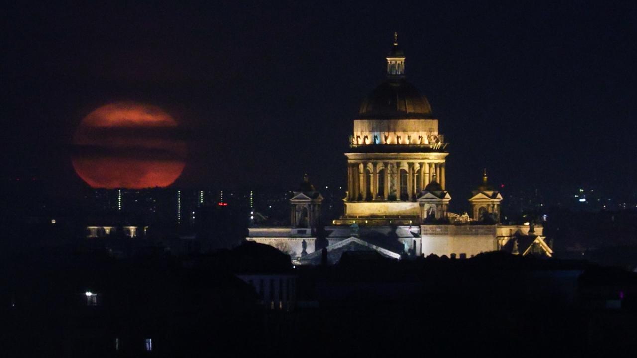 Full moon rises over St. Isaacs Cathedral in St. Petersburg
