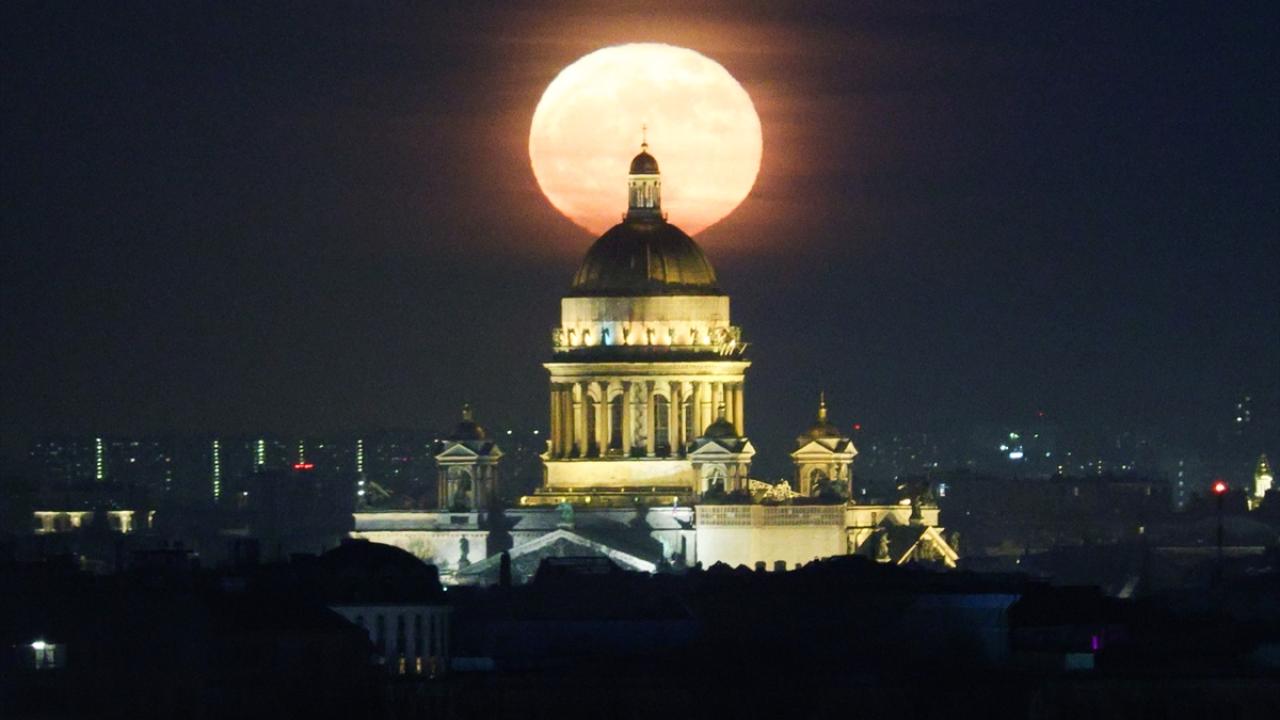 Full moon rises over St. Isaacs Cathedral in St. Petersburg